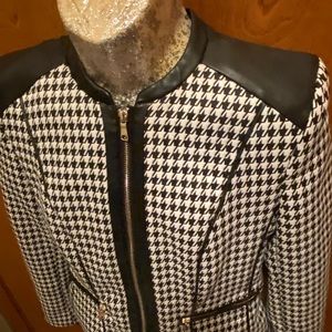 H&M size 8 Houndstooth Suit with Leather trim. Zips on sleeves.Skirt knee length